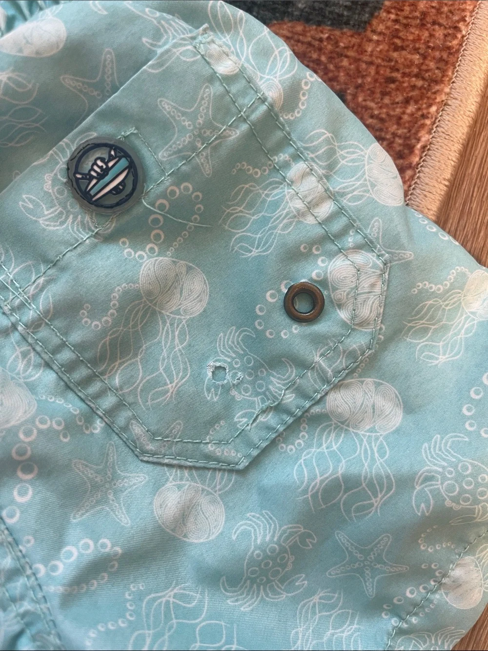 Light Aqua Kids Swim Trunks with Sea Print